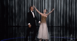 Anne Hathaway Raising Her Hands GIF