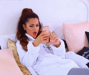Annoyed Niki Demartino Throwing Phone GIF
