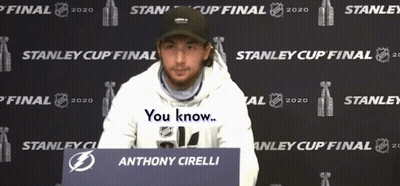 Anthony Cirelli Sitting In Front Of Stanley Cup Sign GIF