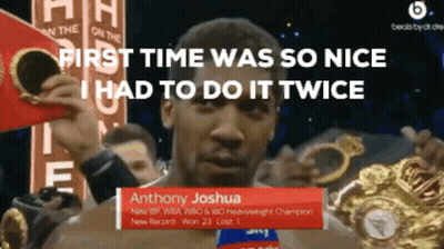 Anthony Joshua Is Holding A Boxing Glove In His Hands GIF