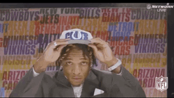 Anthony Richardson Fixing His Cap And Coat GIF