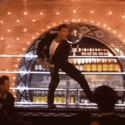 Antonio Banderas Standing On Top Of Bar Counter GIF