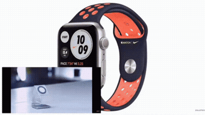Apple Watch With Black and Orange Band Showing 10:10