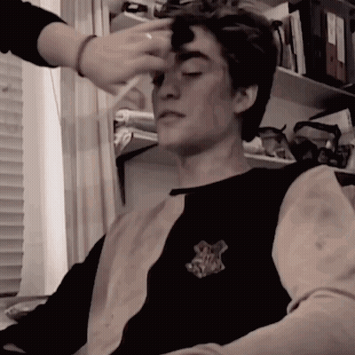 Applying Makeup To Man In Hufflepuff Shirt GIF