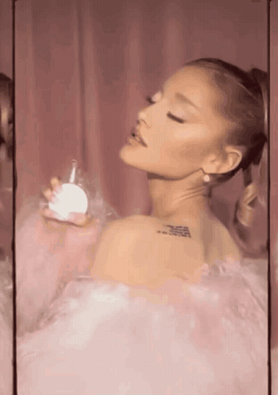 Ariana Grande Holding Perfume Bottle GIF