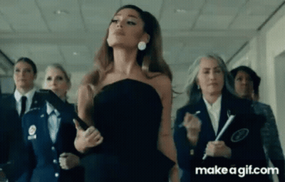 Ariana Grande In Black Dress In Hallway With Group GIF