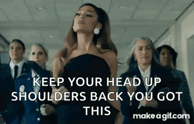 Ariana Grande In Black Dress With Group In Hallway GIF