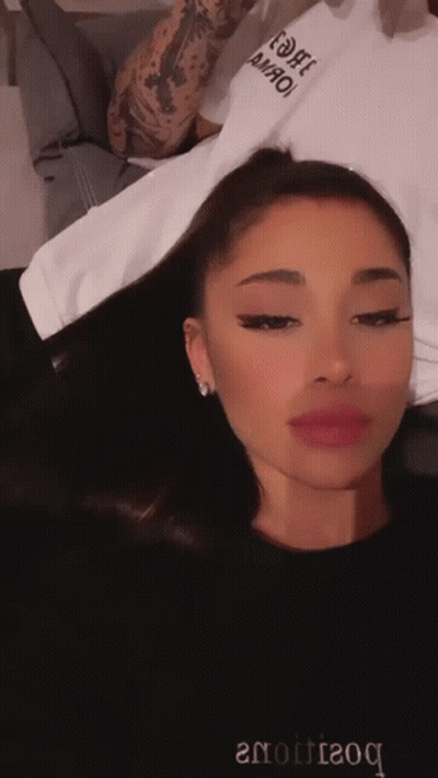 Ariana Grande In Black Sweater Saying Boutique GIF