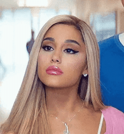 Ariana Grande In Pink Top And Necklace Next To Man GIF