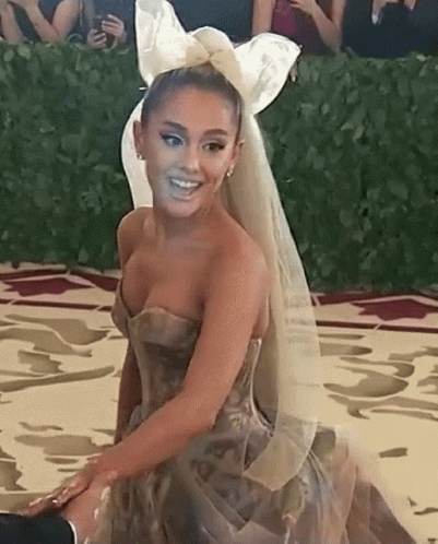 Ariana Grande In Strapless Dress With Veil And Bow At Met Gala GIF
