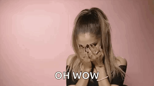 Ariana Grande Is Covering Her Face With Her Hands And Says Oh Wow . GIF