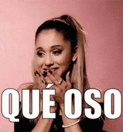 Ariana Grande Is Smiling And Covering Her Mouth With Her Hands While Wearing A Black Top . GIF