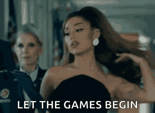 Ariana Grande Is Wearing A Black Dress And Says Let The Games Begin . GIF