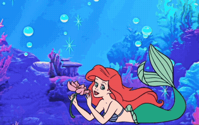 Ariel From The Little Mermaid Is Holding A Pink Flower GIF