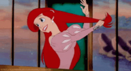 Ariel From The Little Mermaid Is Standing In Front Of A Window GIF