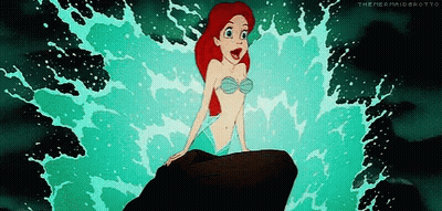 Ariel From The Little Mermaid Sitting On A Rock In The Ocean GIF