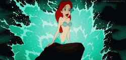 Ariel Getting Splashed By Waves GIF