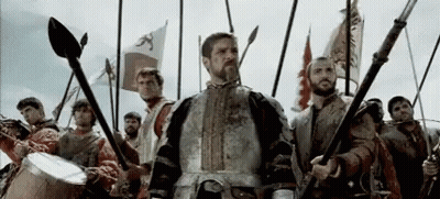 Armored Man Before Men With Spears And Flags GIF