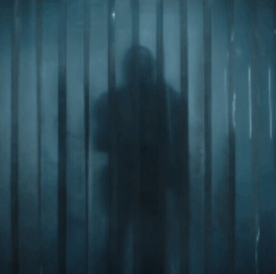 Armored Man Holding Sword In Doorway GIF