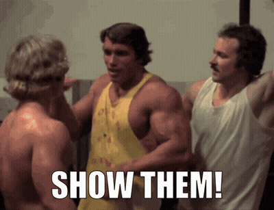 Arnold Schwarzenegger Between Two Shirtless Men Saying Show Them GIF