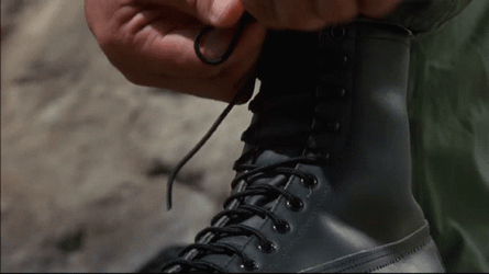 Arnold Schwarzenegger Getting Ready For Combat GIF