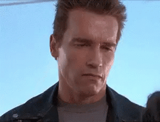 Arnold Schwarzenegger Learning How To Smile Terminator 2 GIF