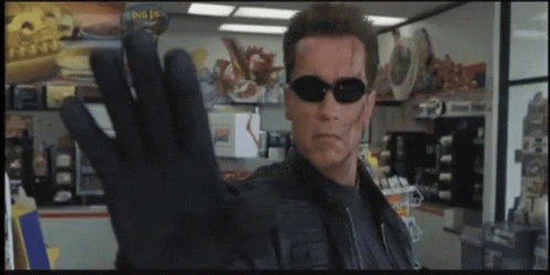 Arnold Schwarzenegger Wearing Sunglasses And Black Glove GIF