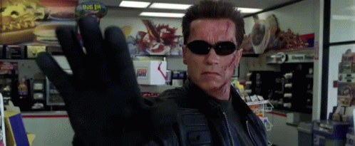 Arnold Schwarzenegger Wearing Sunglasses And Glove GIF