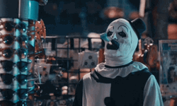 Art The Clown Blows Ribbon Out Mouth GIF