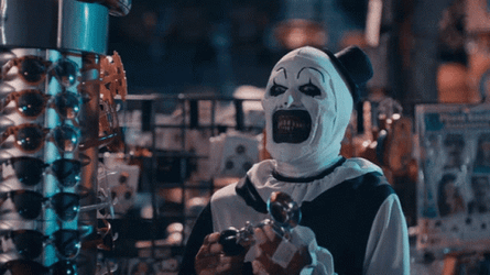 Art The Clown Slowly  Approaches Girl In Store GIF