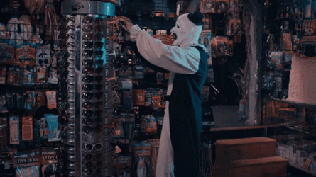 Art The Clown Takes Eyeglass From Display GIF