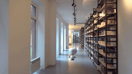 Artificial Intelligence Robot In Library GIF