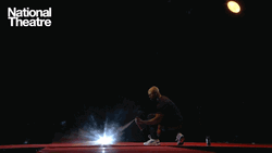Artist Michael Balogun Spraying On Stage GIF