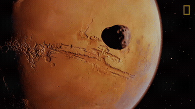 Artist's Impression Of Mars With Large Asteroid GIF