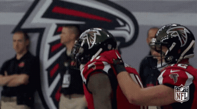 Atlanta Falcons Football Players Hugging NFL Logo GIF