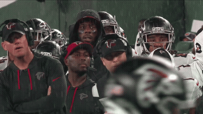 Atlanta Falcons Football Players Standing In Rain GIF