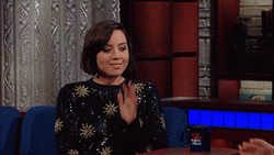 Aubrey Plaza Leaning And Listening To Someone GIF
