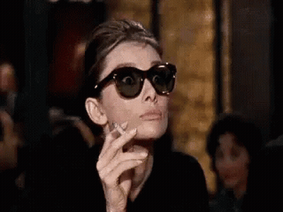 Audrey Hepburn Smoking With Sunglasses GIF