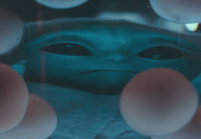 Baby Alien Surrounded By Balls GIF
