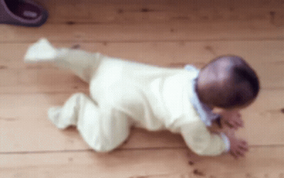 Baby Crawling On Wooden Floor Blurry Photo GIF