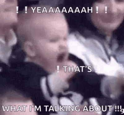 Baby Crying In Crowd Held By Woman GIF