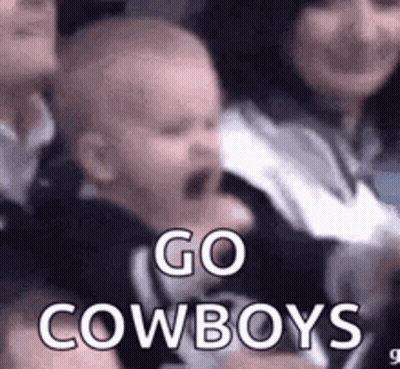 Baby Crying In Crowd Held By Woman GIF