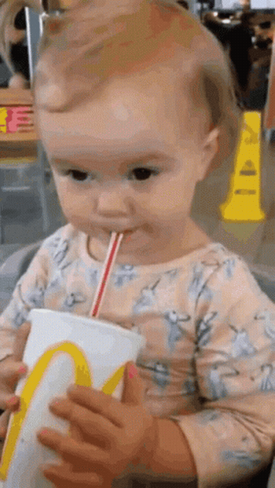 Baby Drinking From McDonald's Cup Through Straw GIF