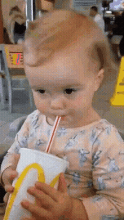 Baby Drinking From McDonald's Cup With Straw GIF