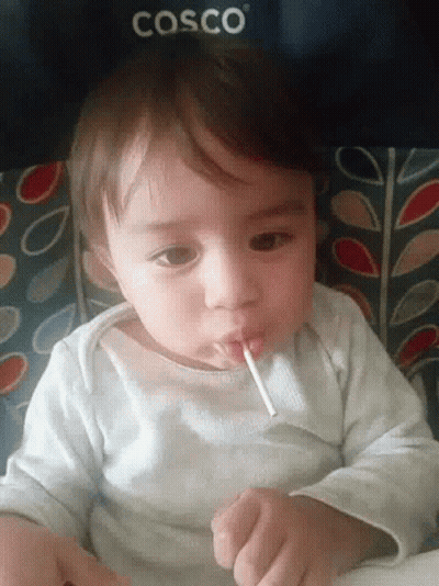 Baby Drinking From Straw In Cosco Chair GIF
