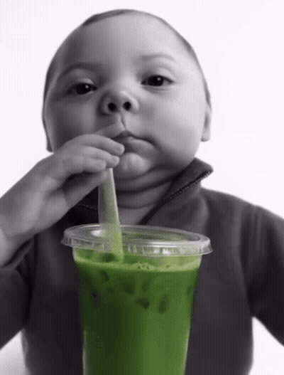 Baby Drinking Green Drink With Straw GIF