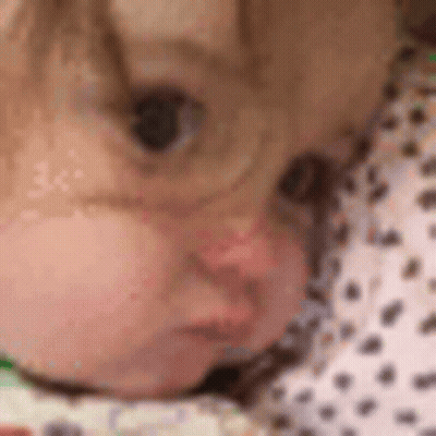 Baby Face Closeup On Blanket GIF
