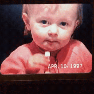Baby Face On Screen With Date April 10 1997 GIF
