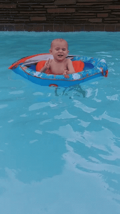Baby Floating In Boat In Pool GIF