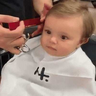 Baby Gets Haircut From Barber GIF